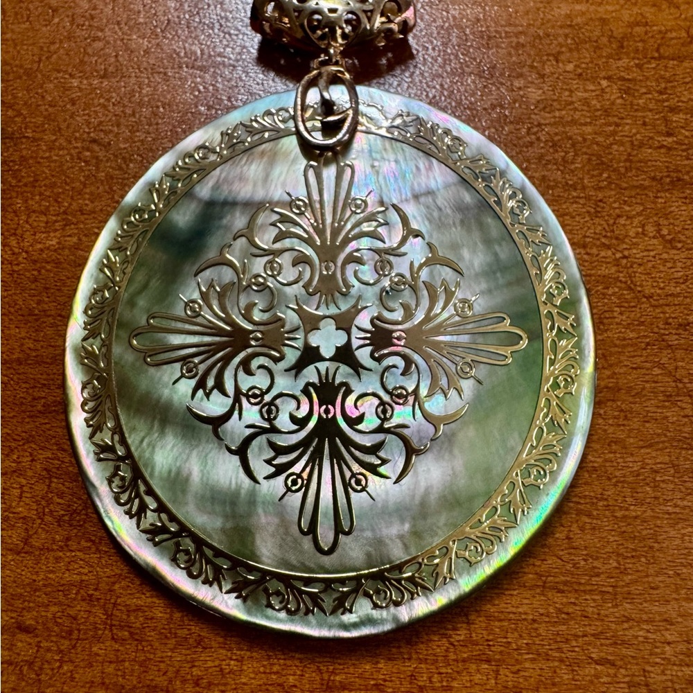 Elegant Mother of Pearl Pendant with Gold Accents